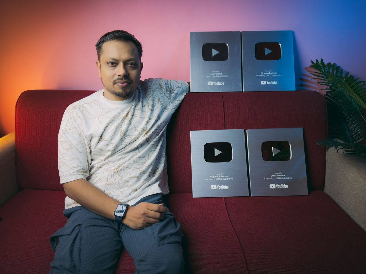 Waqutiar Rahaman seated with four YouTube Silver Play Button awards
